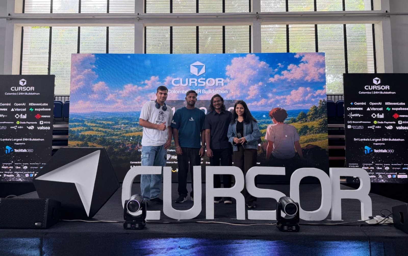The Nasiko team on stage at Cursor Buildathon 2026 in Colombo, in front of the event's LED wall and sponsor boards.
